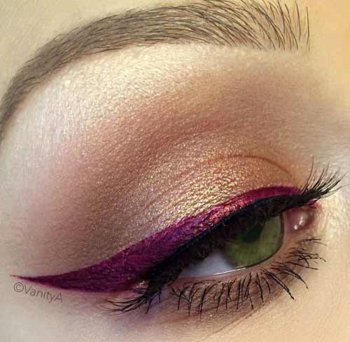 Yeux verts et eye-liner violet