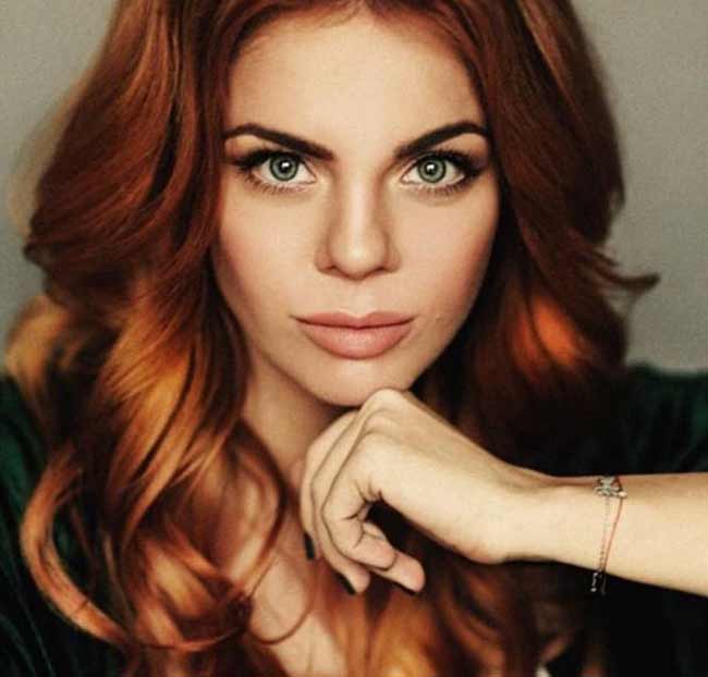 Anastasia Stotskaya with red head of hair