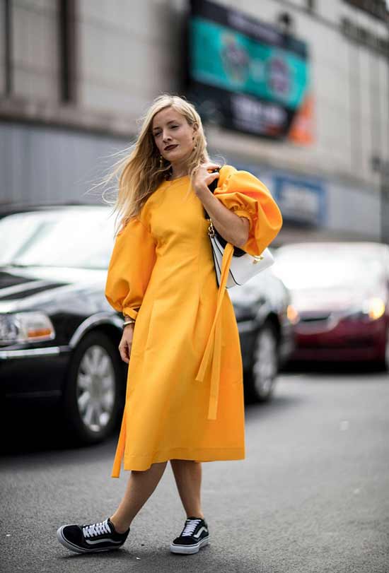 Bright image of a midi dress and sneakers