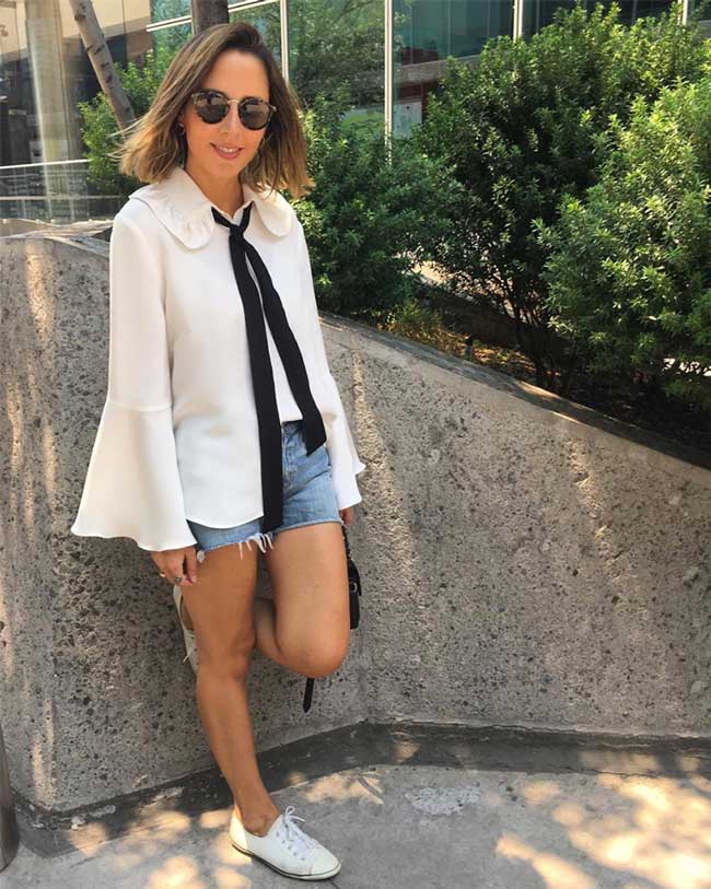 Shorts and a white blouse with wide sleeves