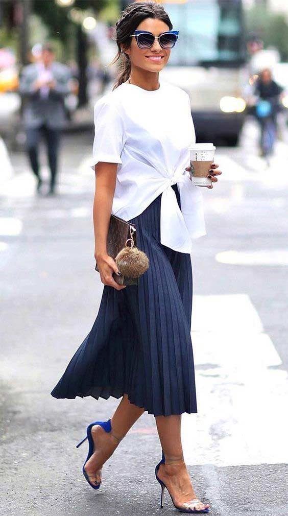 Skirt and voluminous white blouse