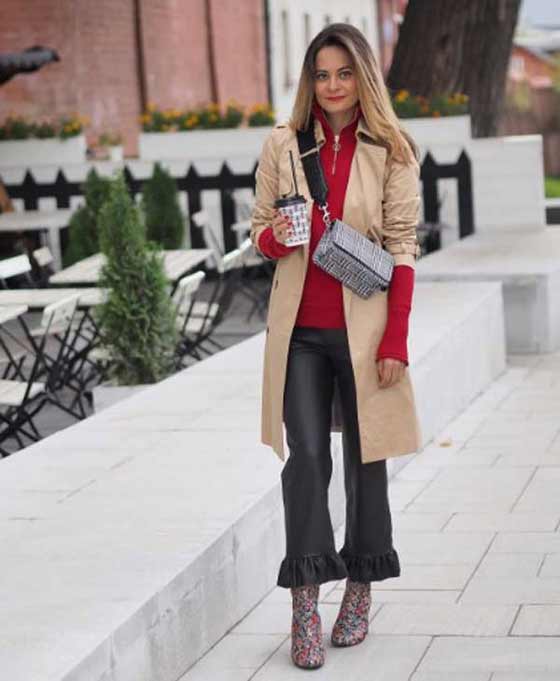 With trench coat + red sweater + ruffled pants