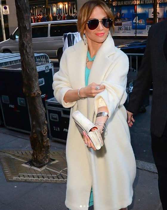 Jennifer Lopez in a white coat