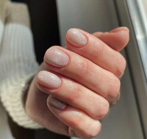 Festive beige glitter manicure