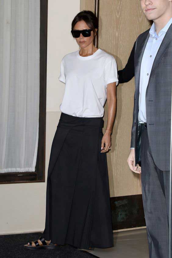 Victoria Beckham in a long skirt to the floor