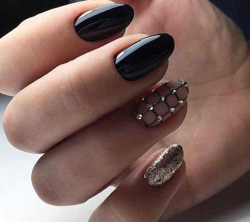 Black manicure with rhinestones and sparkles