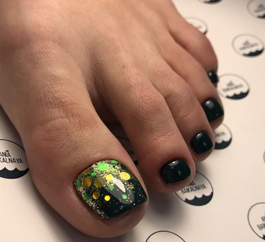 Black pedicure with confetti