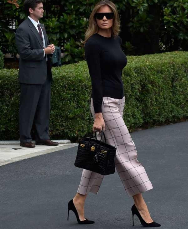 Melania in a turtleneck and culottes