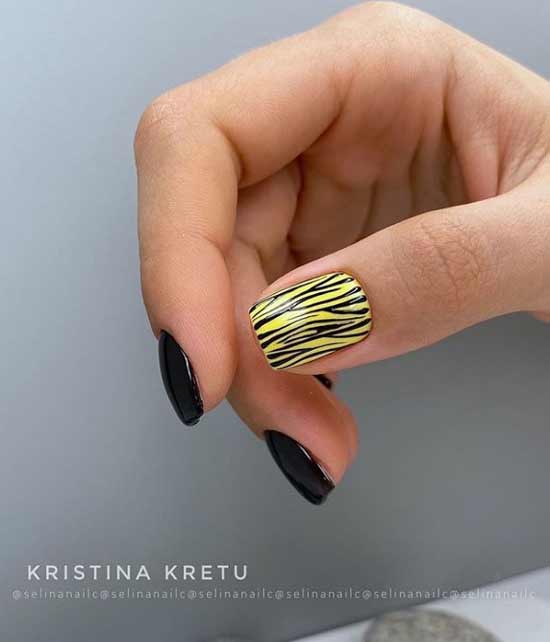 Black manicure with a bright print