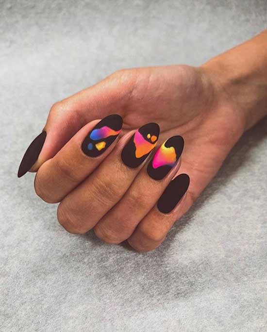 Black manicure with bright stains