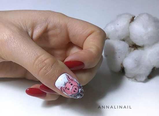 Red manicure with a pattern of a boar