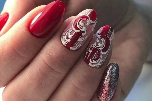 Red manicure with monograms