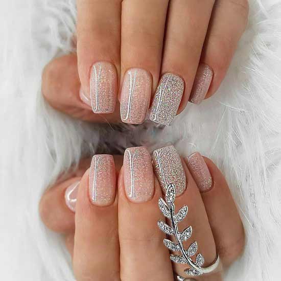 Delicate winter manicure: fashionable ideas of stylish nail art photo with sparkles