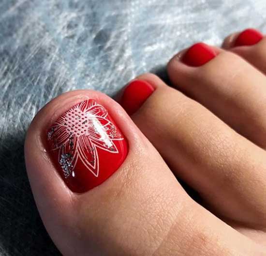 Red pedicure with floral print