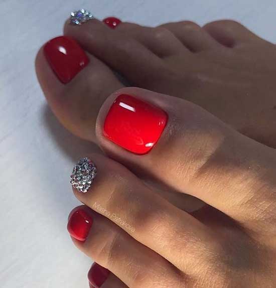 Red pedicure with rhinestones