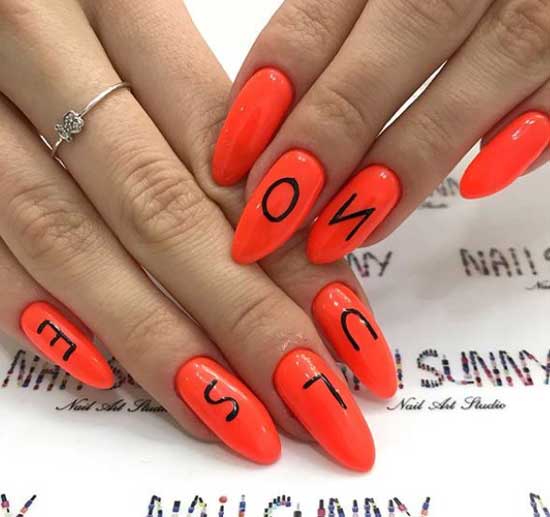 Bright manicure with the inscription