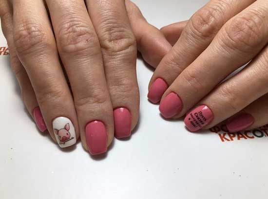 Manicure with lettering on a pink background