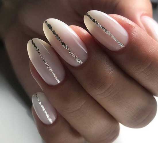 Glitter stripes and milky color in the manicure