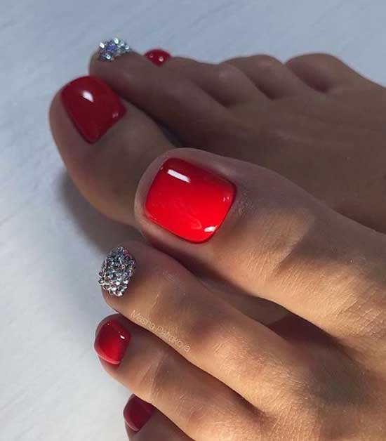 Red pedicure with rhinestones