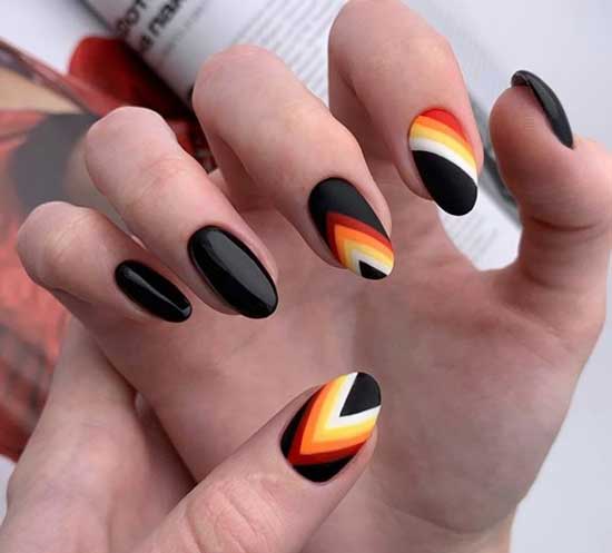 Black manicure with multi-colored stripes