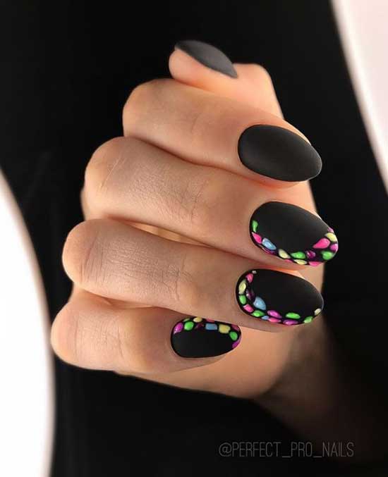 Matte black nails and neon specks