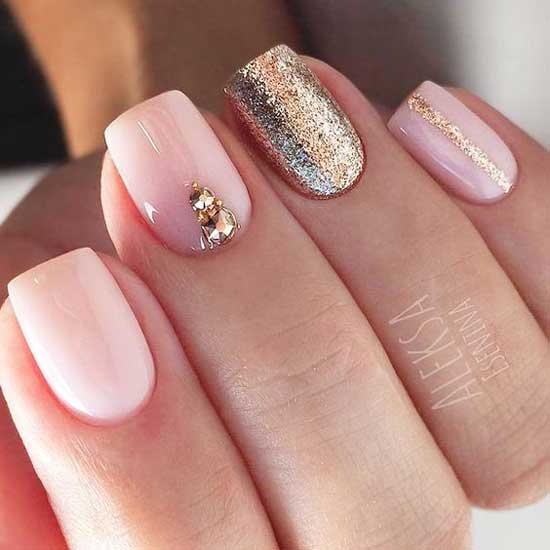 Manicure with gold rhinestones