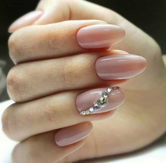 Nude manicure and colored rhinestones