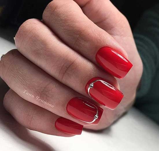 Red manicure with rhinestones