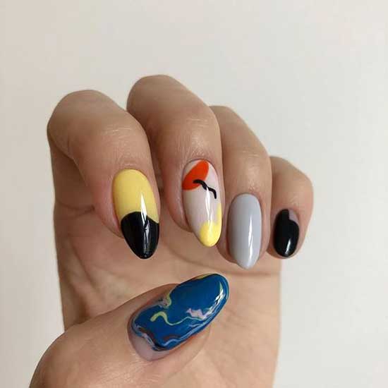 Multi-colored manicure with bright drawings