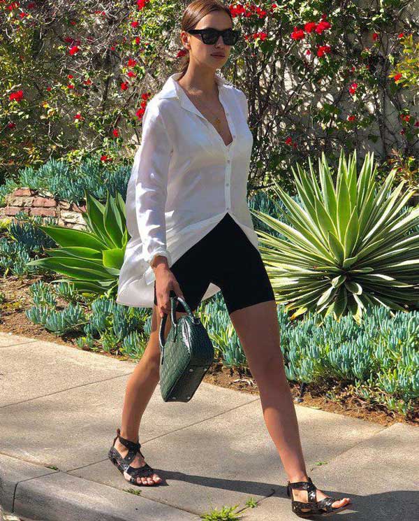 Sports sandals with bicycles and a white long shirt