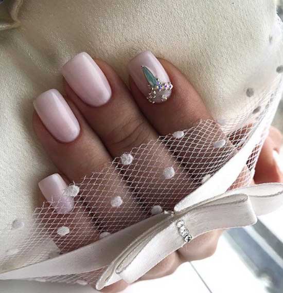 Light manicure with rhinestones