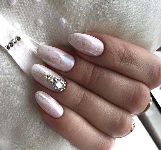 Light manicure with shiny decor