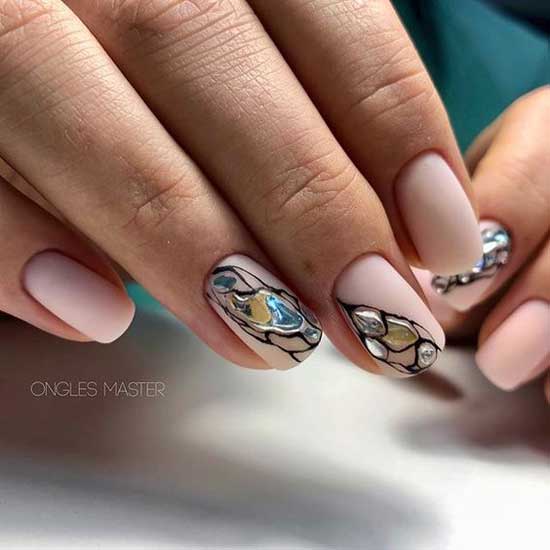 Manicure in beige tones and decor of the tears of a uniform