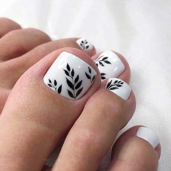 White pedicure with twig pattern