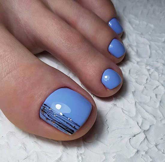 Blue pedicure with a pattern