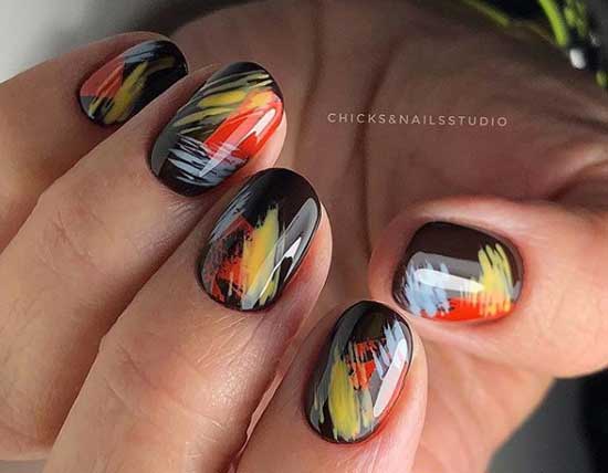 Black manicure with coral accents