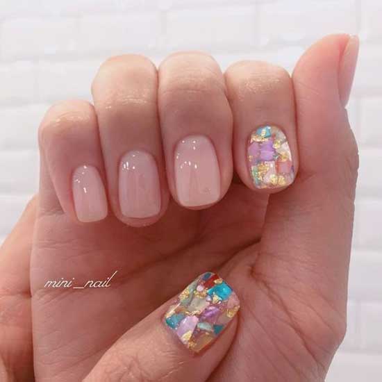 Beige manicure with broken glass effect