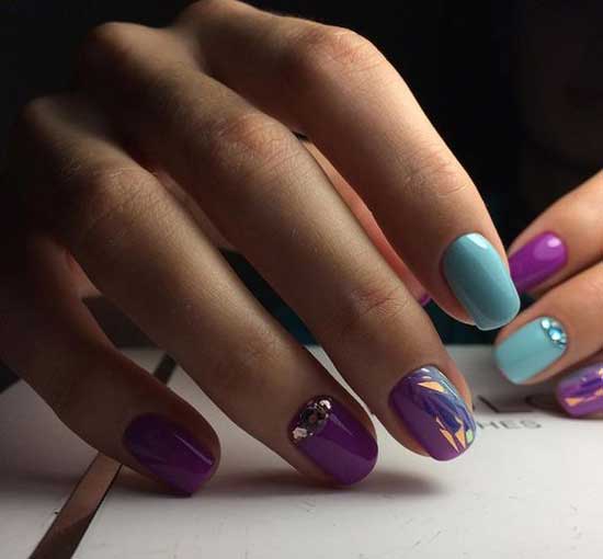 Multi-colored manicure and broken glass