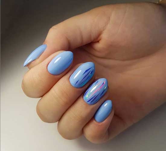 Manicure in blue tones and broken glass