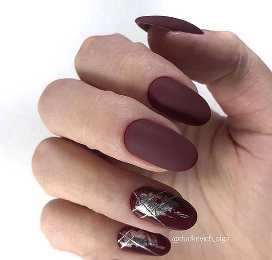 Matte manicure with foil decor in burgundy color