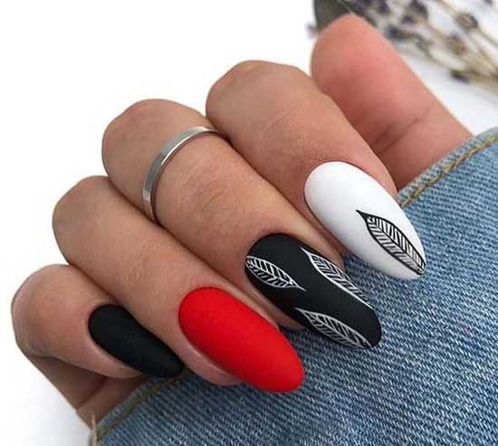 Manicure autumn design in red and black tones with a pattern