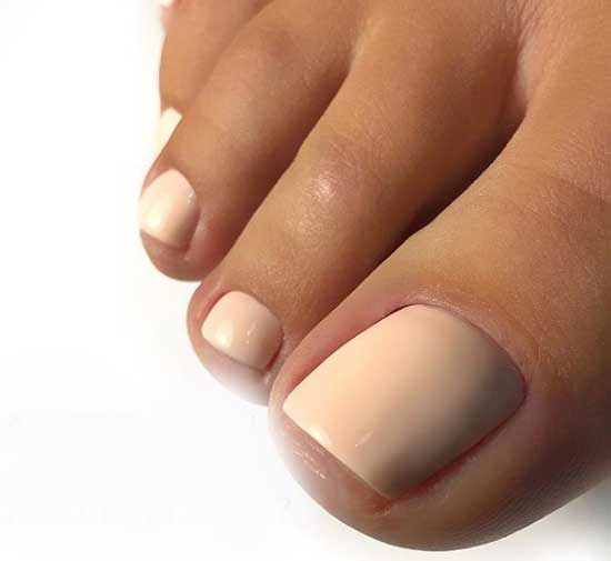 Peach color pedicure