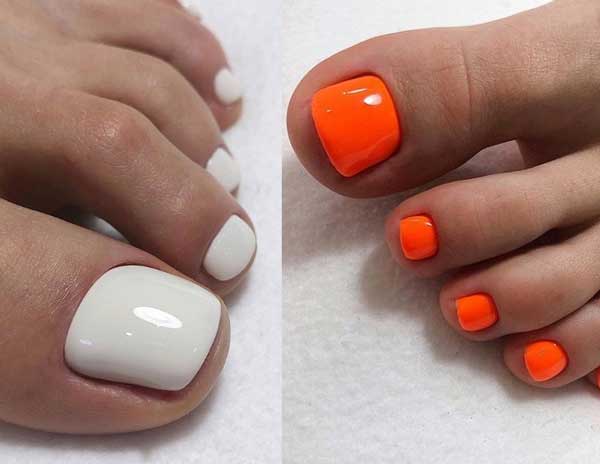 White and orange pedicure