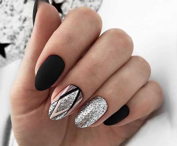 Black manicure with foil