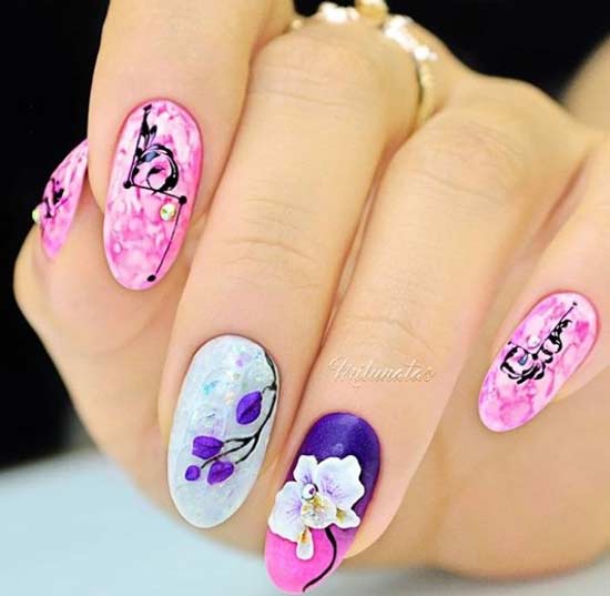 luxurious layered design on oval shaped nails