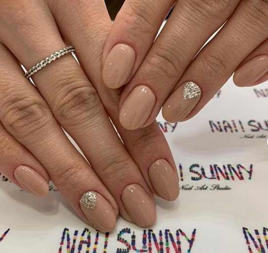 Lunar nude manicure with silver sequins