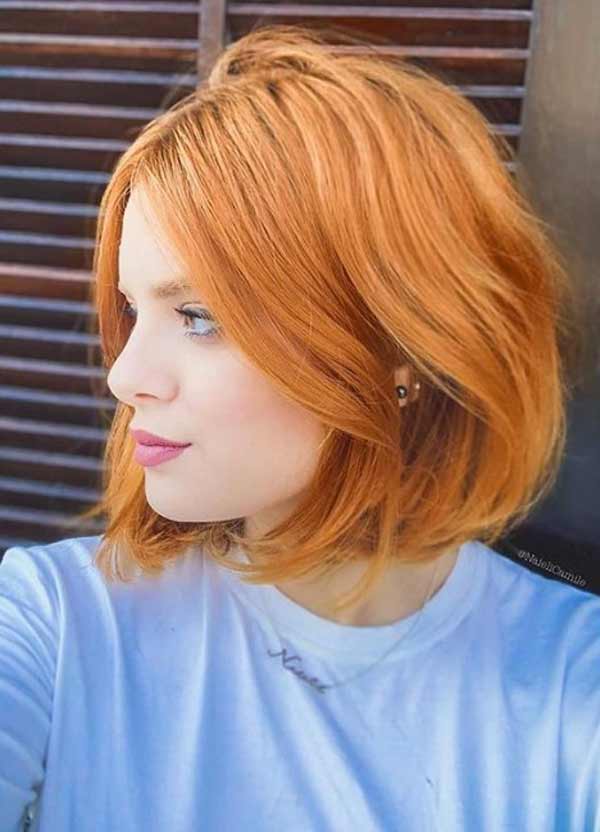 Red-haired girl with a fashionable haircut