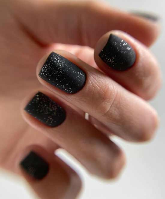 Black manicure with glitter photo