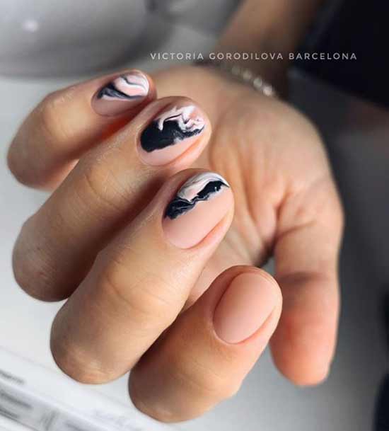 Black manicure with a pattern of haze