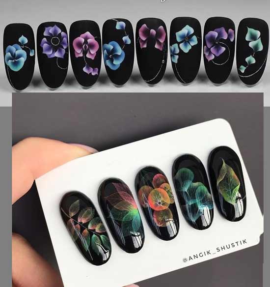 Drawing on a black background of nails using the airflowers technique with gel varnish